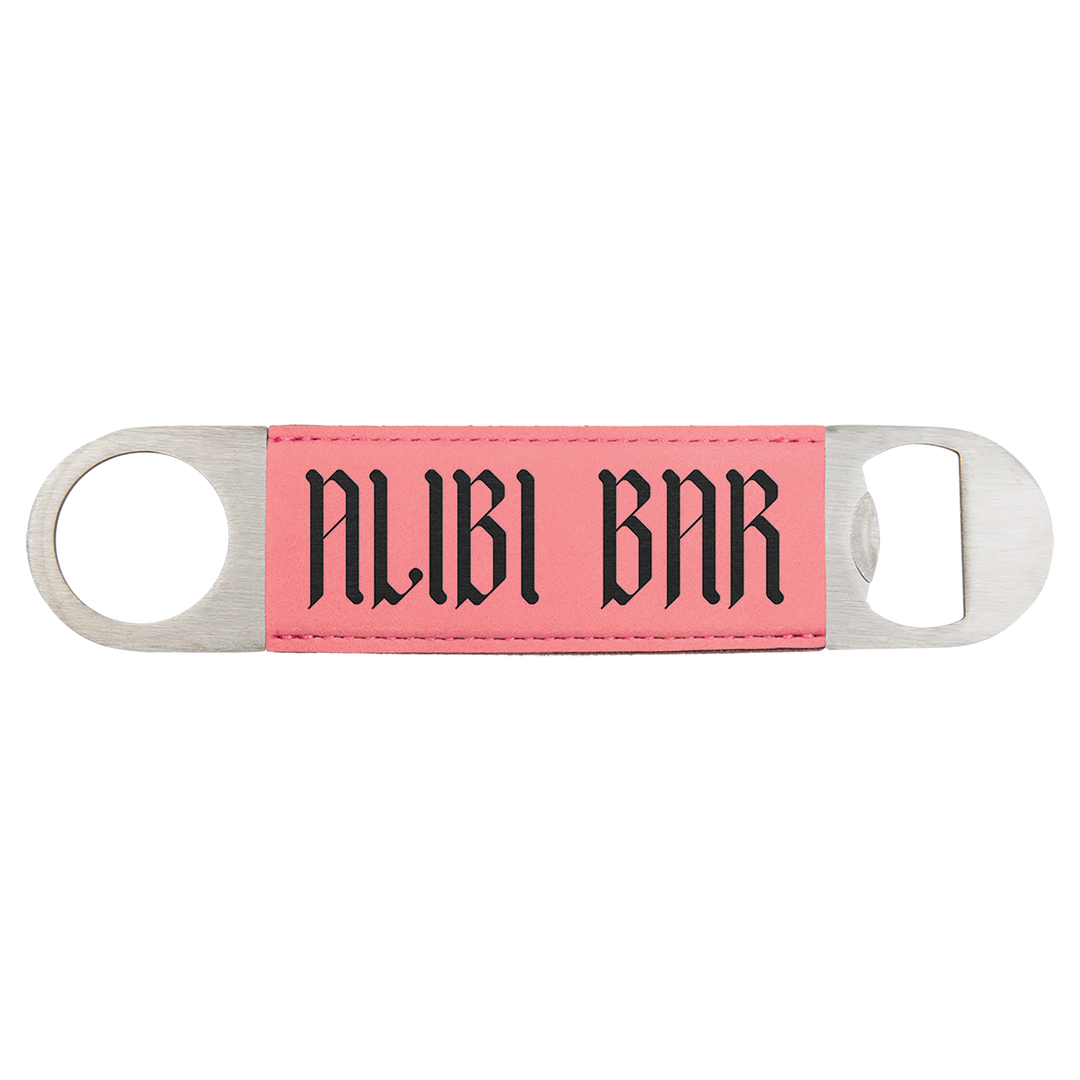 a pink and black key chain with the word nubi bar on it
