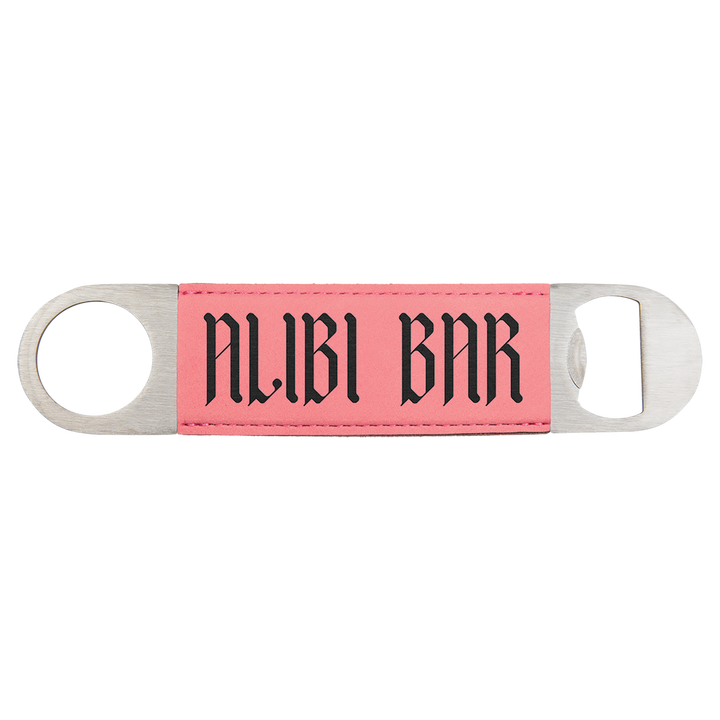 a pink and black key chain with the word nubi bar on it